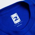 Load image into Gallery viewer, 2 Riser Pads T-Shirt Band Royal Blue neck tag close up
