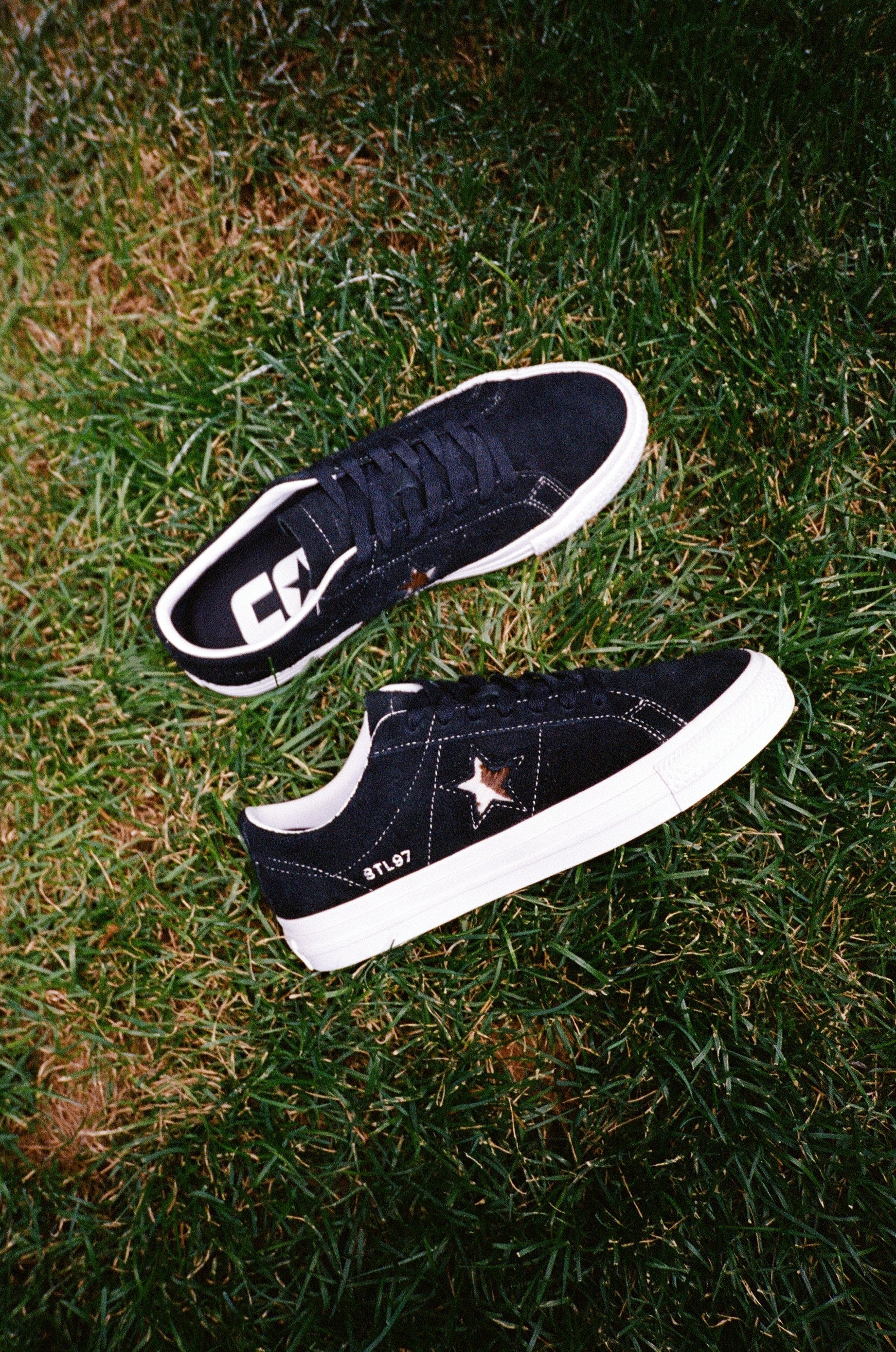 Converse Cons X BTL One Star Pro Black / Egret / Pasture pair on grass