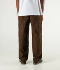 Load image into Gallery viewer, Former Pant Distend VT Brown back view on model
