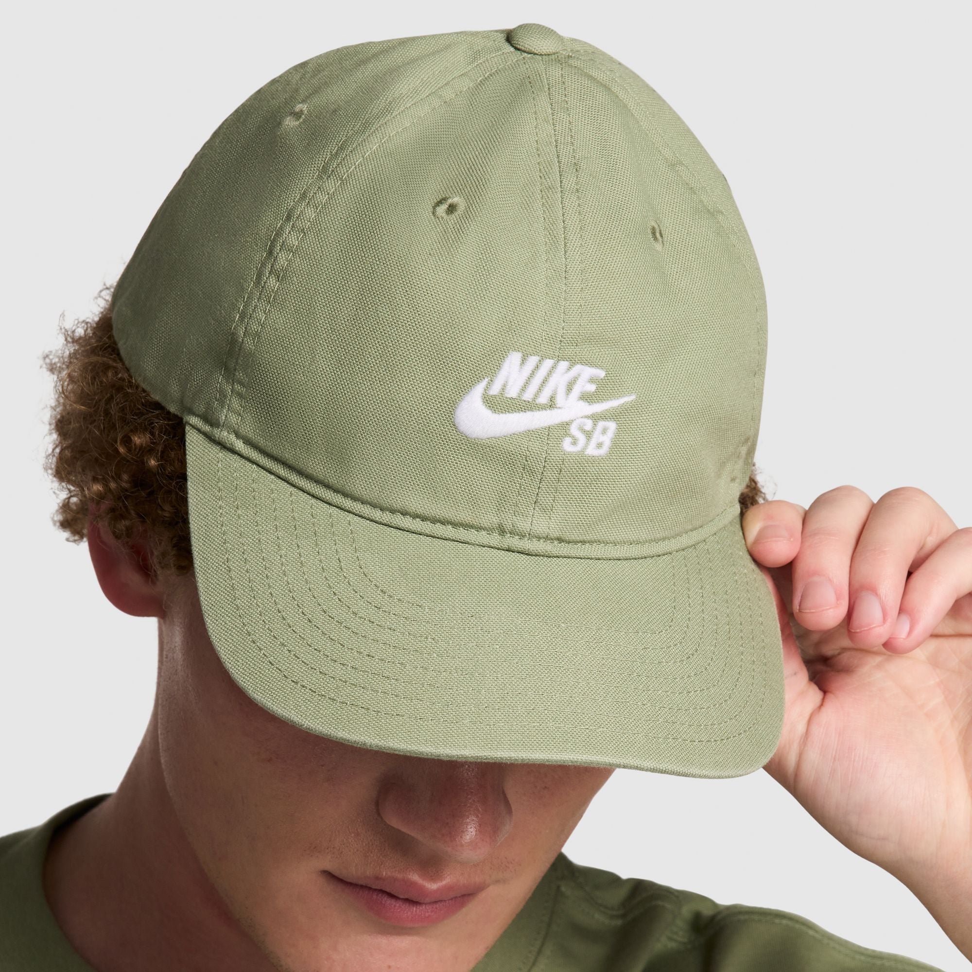 Nike SB 6 Panel Hat Club Cap Oil Green/White on model